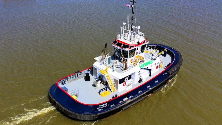 Tugboat navigating through waterway.